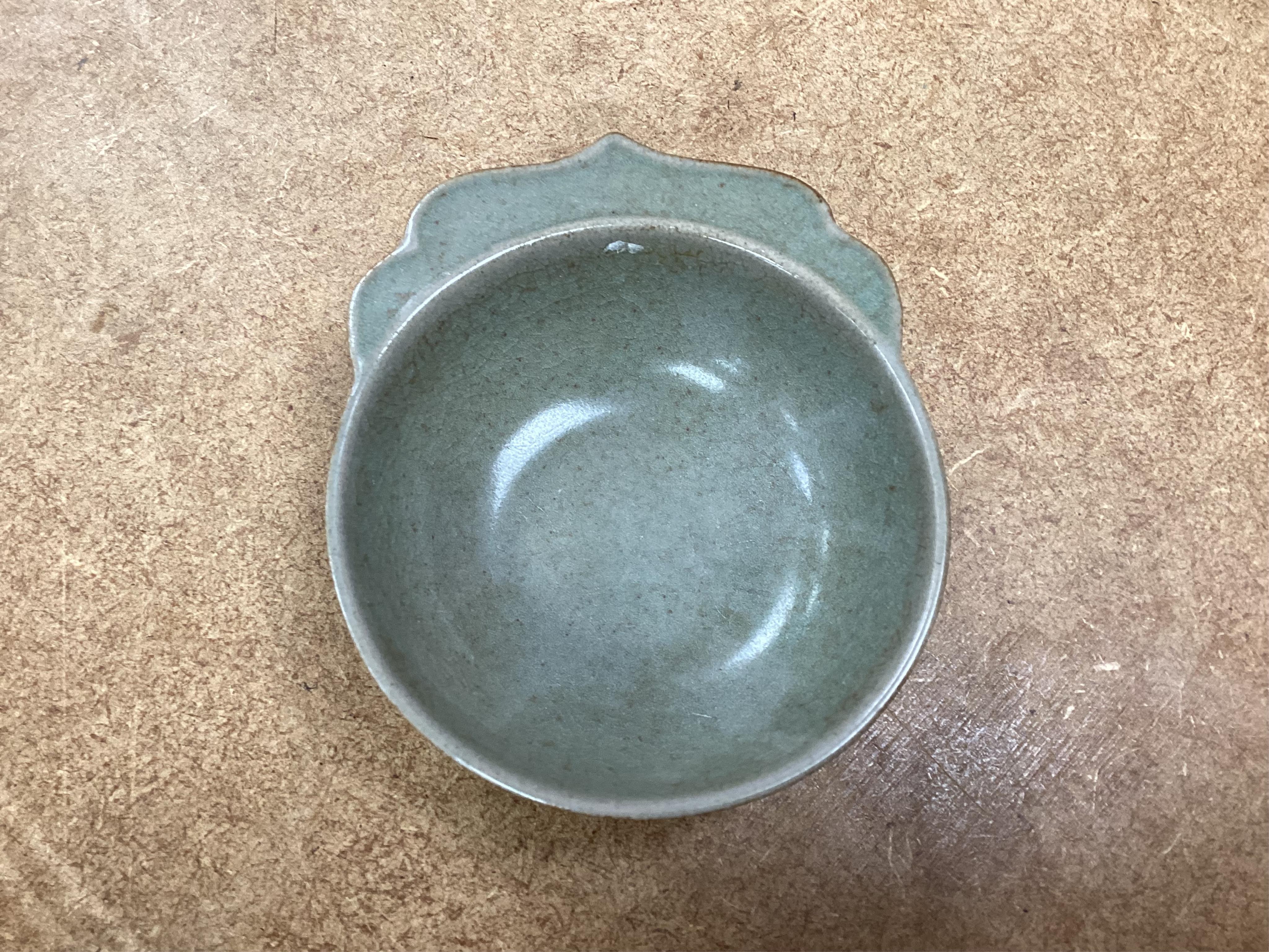 A collection of Chinese porcelain and pottery to include a naturalistic teapot, crackle glaze bowl and a ‘dragon’ bowl, largest 10cm in diameter